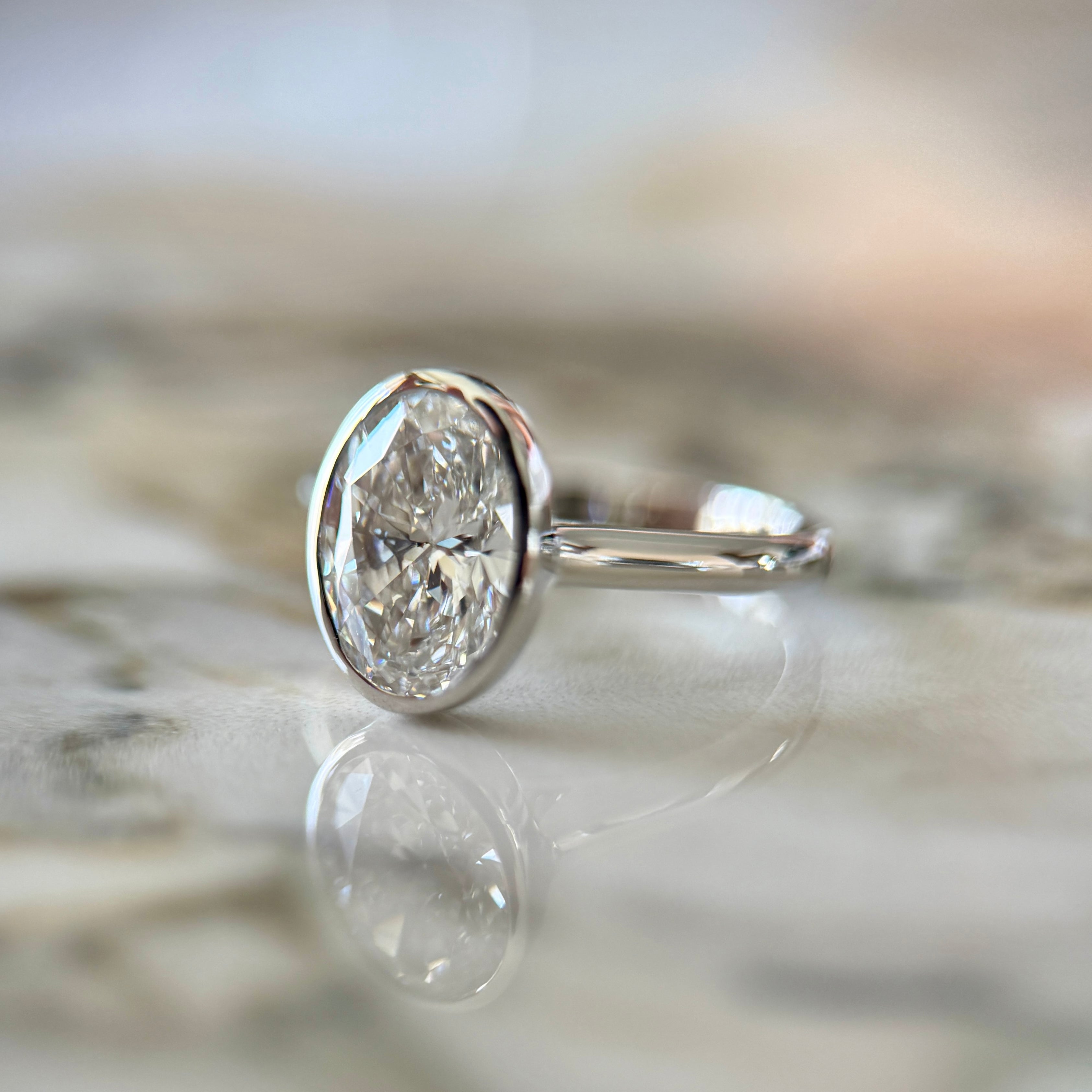 Bezel Set Classic Oval Cut Solitaire - 2ct+ (10mm+, D/E & VVS)