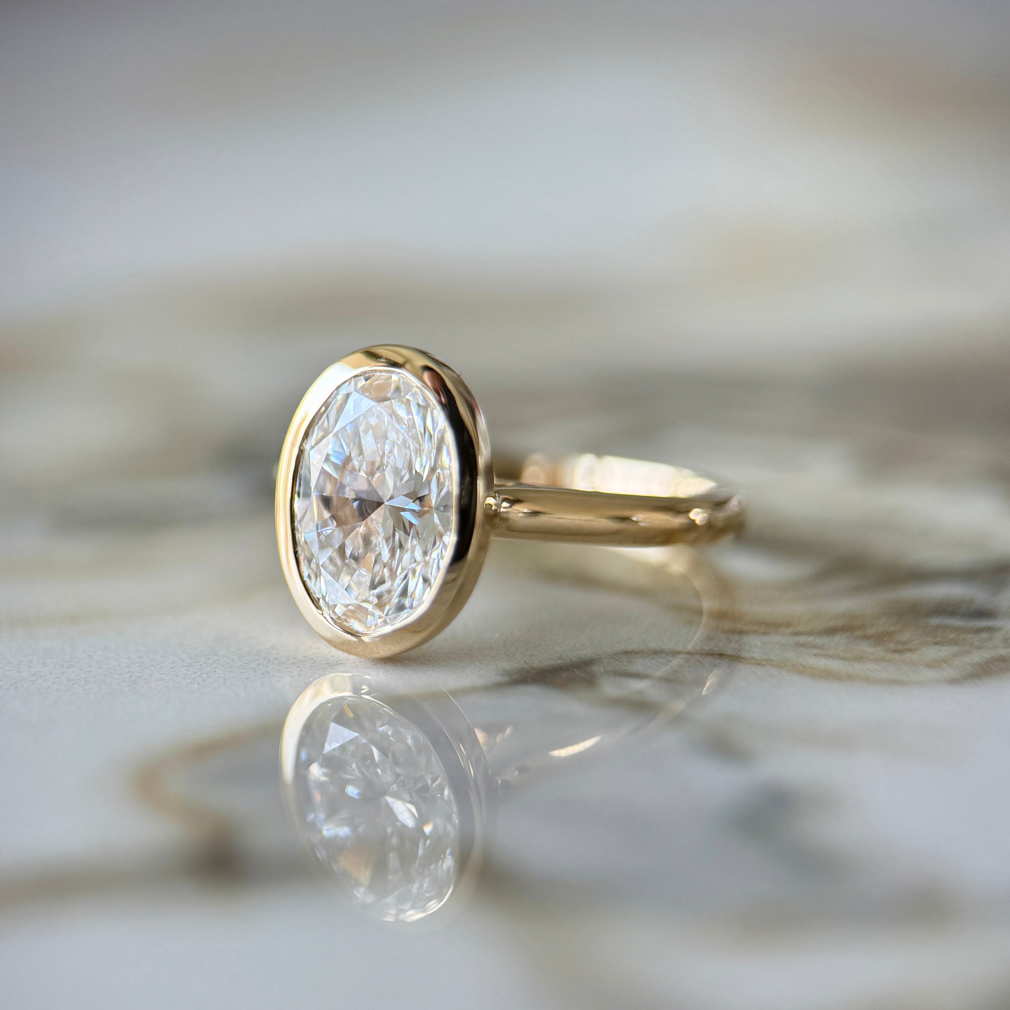 Bezel Set Classic Oval Cut Solitaire - 2ct+ (10mm+, D/E & VVS)