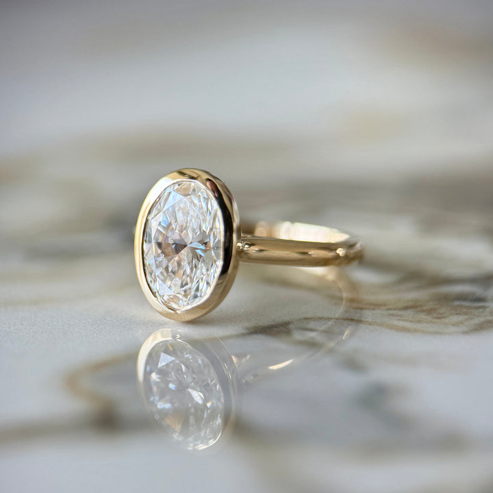 Bezel Set Classic Oval Cut Solitaire - 2ct+ (10mm+, D/E & VVS)