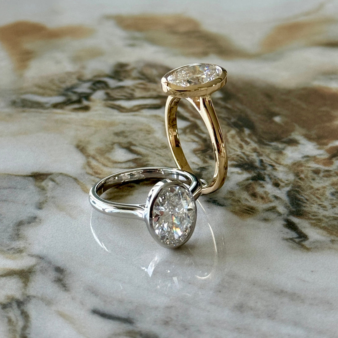 Bezel Set Classic Oval Cut Solitaire - 2ct+ (10mm+, D/E & VVS)