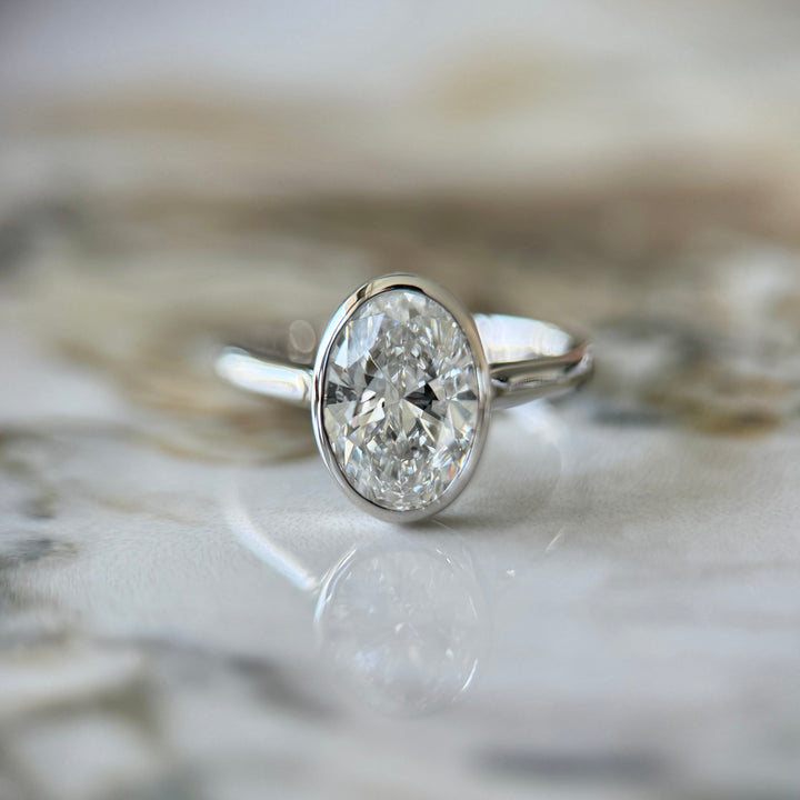 Bezel Set Classic Oval Cut Solitaire - 2ct+ (10mm+, D/E & VVS)