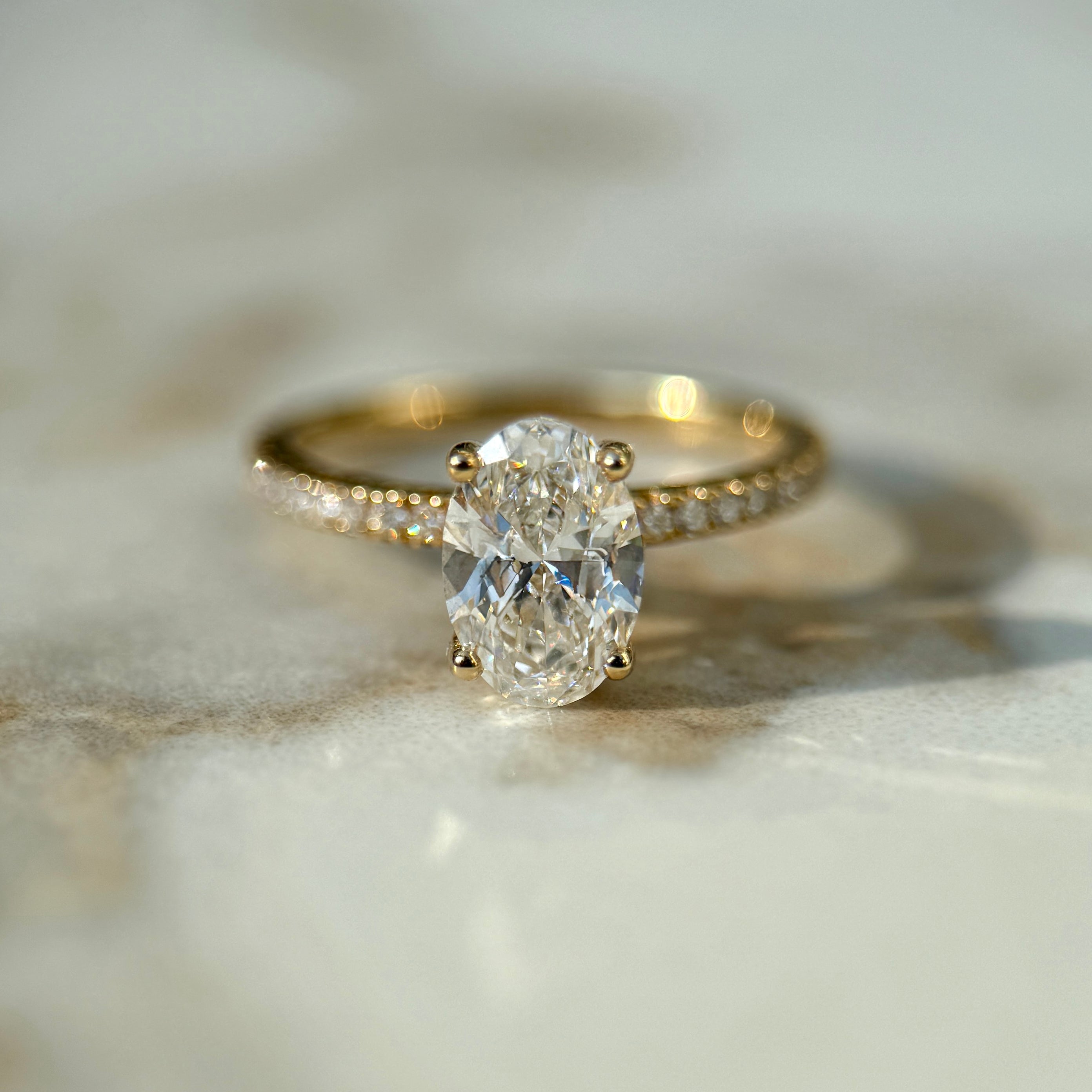 Classic Oval Cut Solitaire with Diamond Band - 1ct+ (8mm+, D/E & VVS)