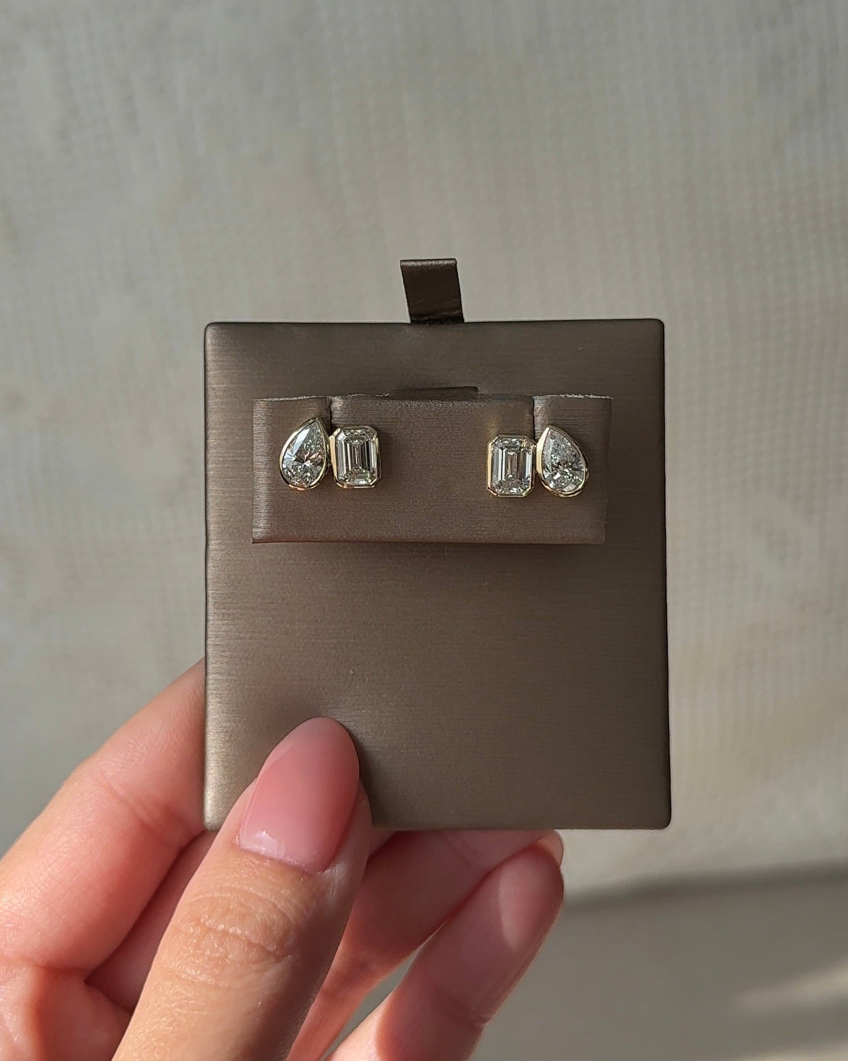50 and 70 Pointer Emerald and Pear cut Diamond Toi Et Moi Stud Earrings in Bezel Petite Setting (with Comfort Fit Backing)
