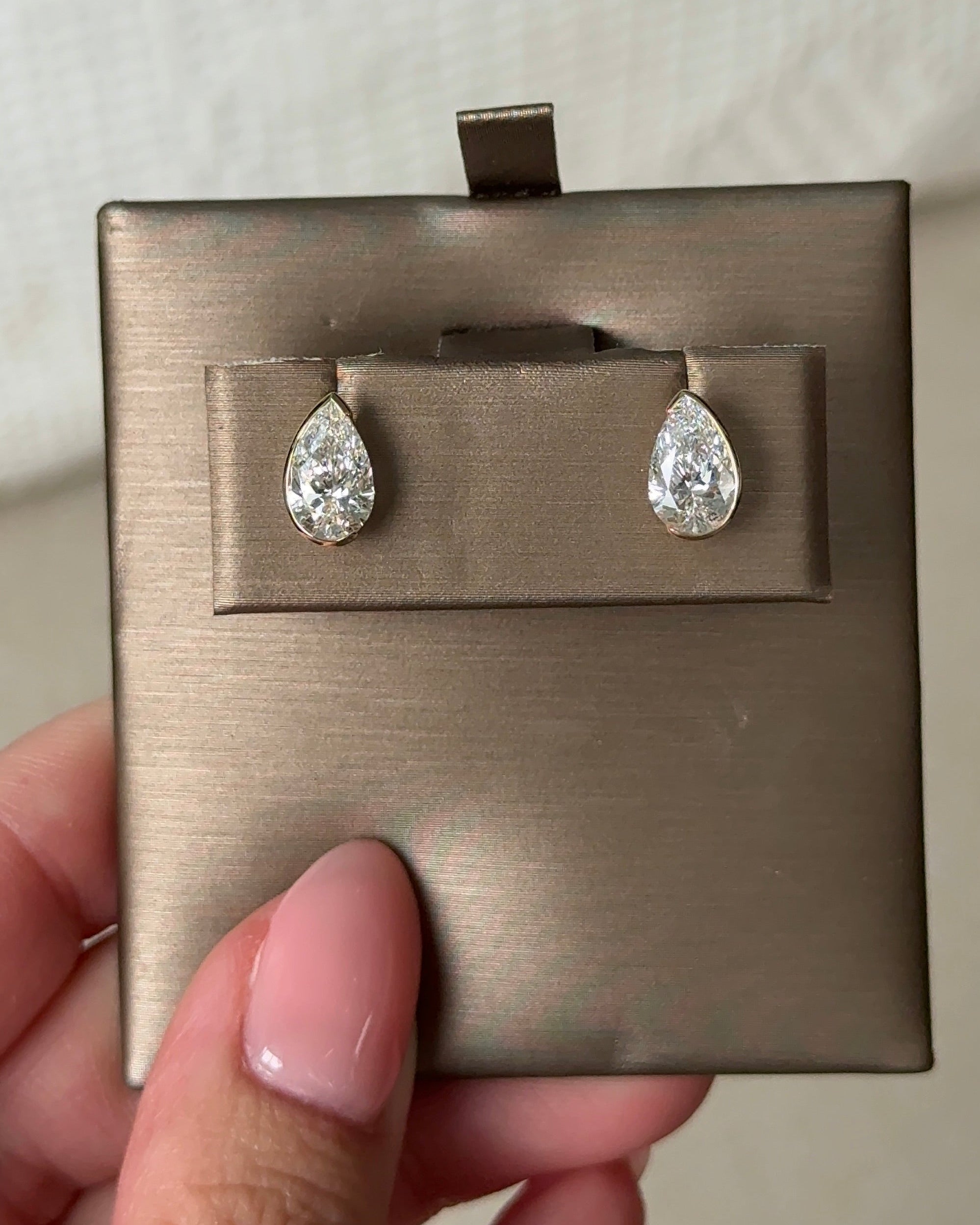1 Carat Pear Diamond Stud Earrings in Bezel Arc Setting (with Comfort Fit Backing)