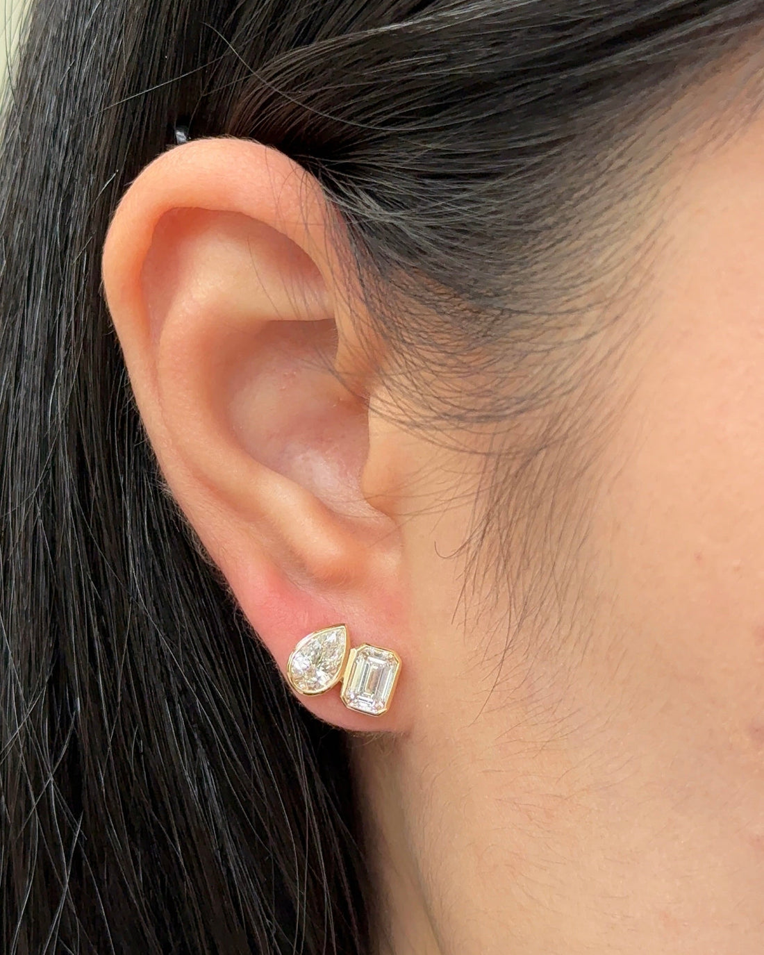 50 and 70 Pointer Emerald and Pear cut Diamond Toi Et Moi Stud Earrings in Bezel Petite Setting (with Comfort Fit Backing)