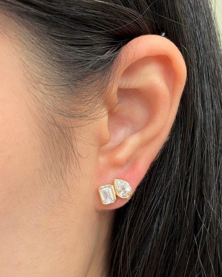 50 and 70 Pointer Emerald and Pear cut Diamond Toi Et Moi Stud Earrings in Bezel Petite Setting (with Comfort Fit Backing)